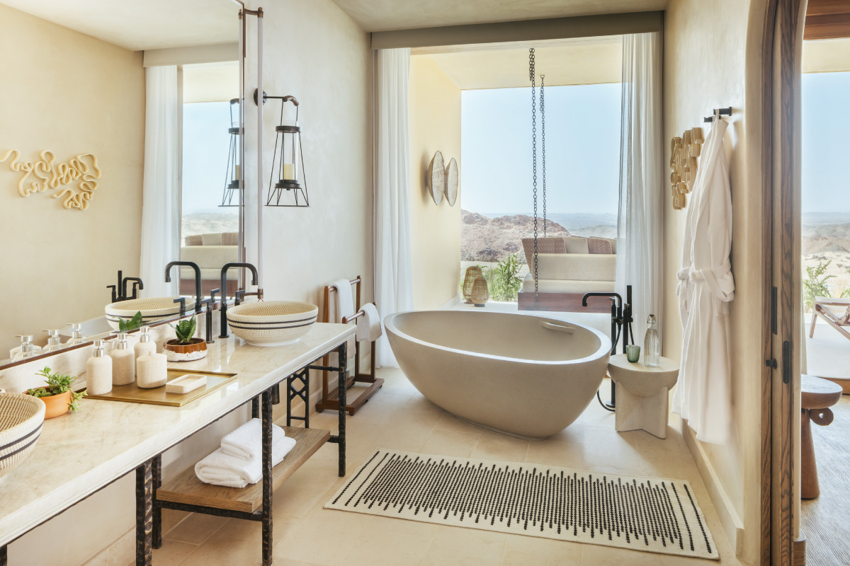 A bathtub in a luxury hotel bathroom