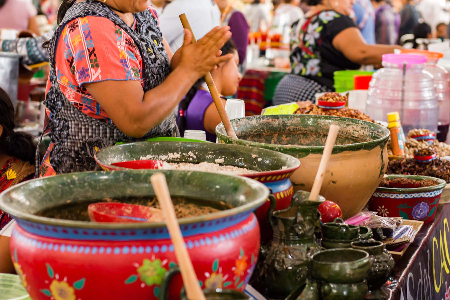 cooking pots in a crowded market in Latin America