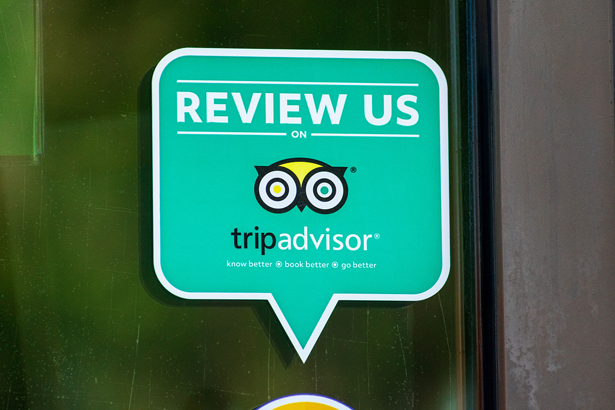 A Tripadvisor vinyl decal on a restaurant window.