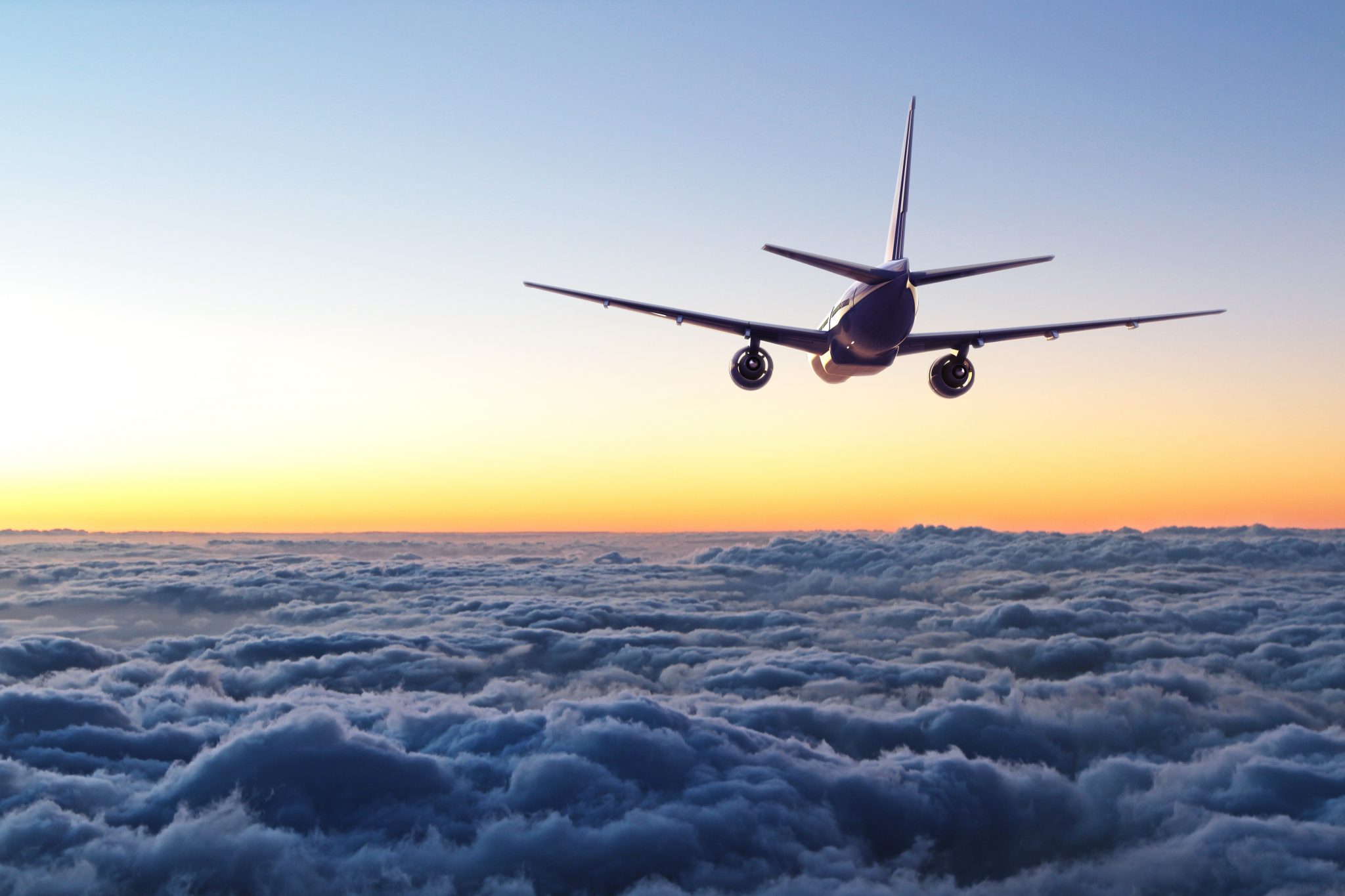 plane flying away in the sky