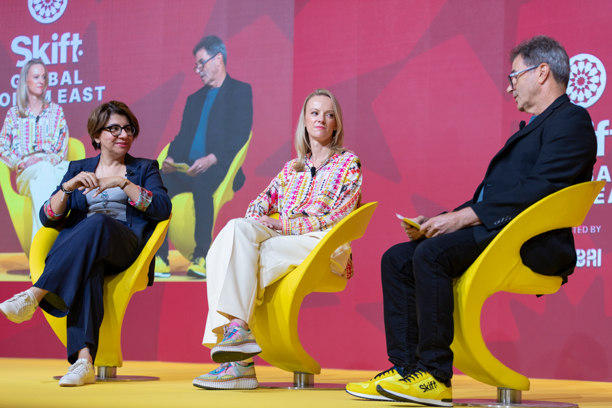 Women on stage at a conference