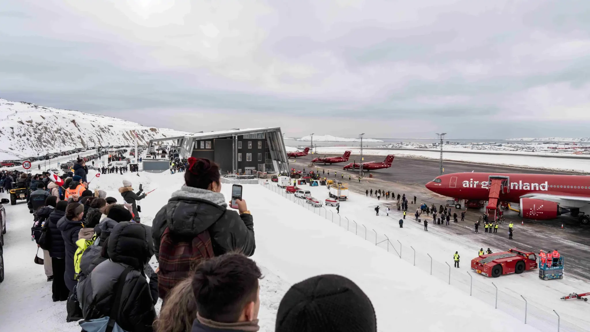 Crowds gather at the upgraded Nuuk Airport in Greenland for the first long-haul flight.